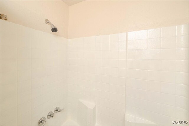 interior details featuring bathing tub / shower combination