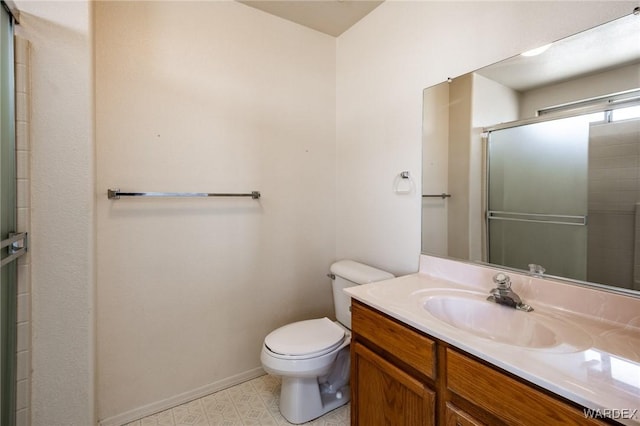 full bathroom with toilet, vanity, a shower with door, and baseboards