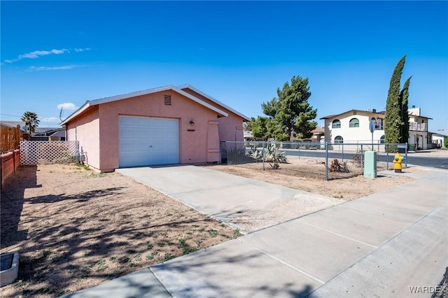 exterior space with driveway and fence