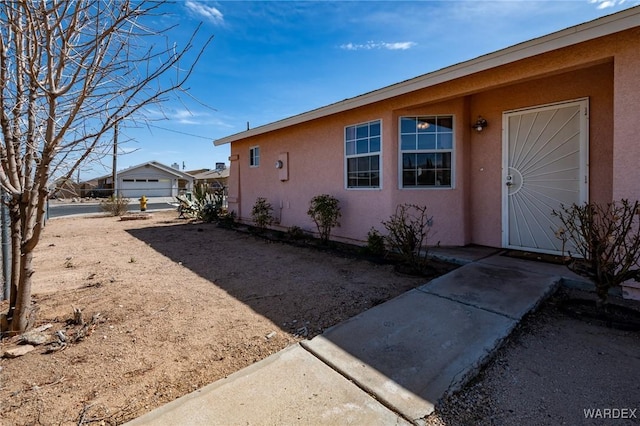 view of side of property featuring stucco siding