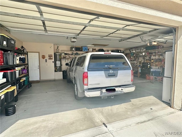 garage with gas water heater and a garage door opener