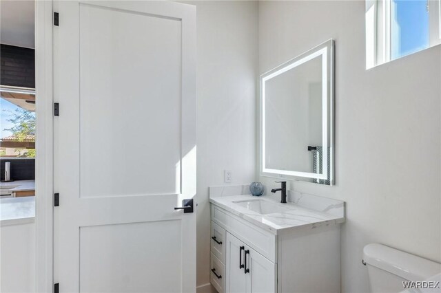 half bath with toilet and vanity