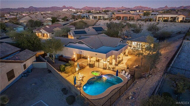 aerial view at dusk with a residential view and a mountain view