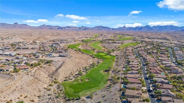 aerial view with view of golf course, a residential view, and a mountain view