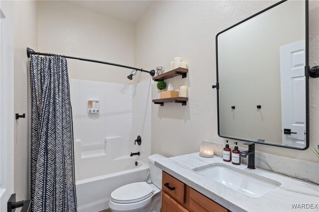 bathroom with toilet, shower / bath combo, and vanity