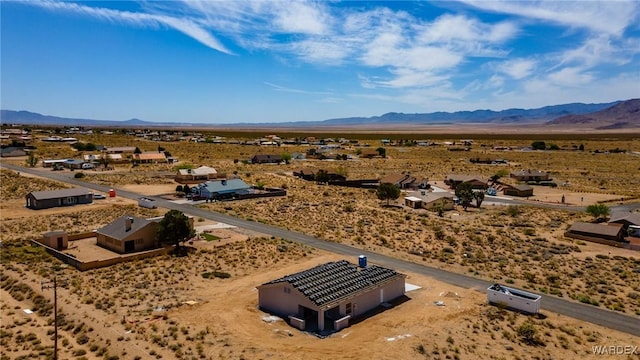 drone / aerial view with a rural view, a mountain view, and view of desert