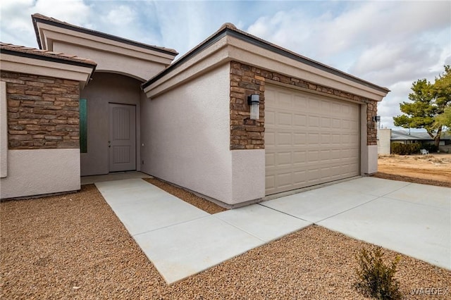 garage featuring driveway