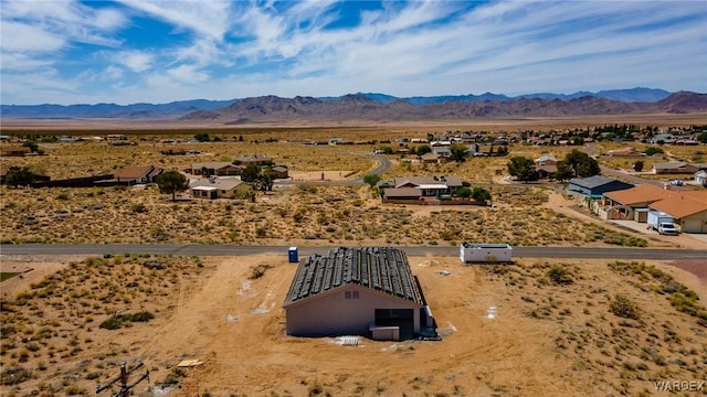 birds eye view of property featuring a rural view, a mountain view, and view of desert