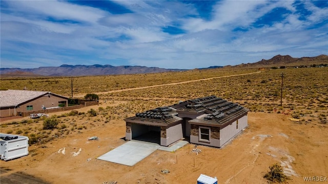 aerial view featuring a rural view, a mountain view, and view of desert