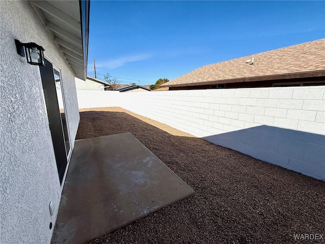 view of yard featuring a patio area and a fenced backyard