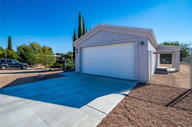 detached garage with fence