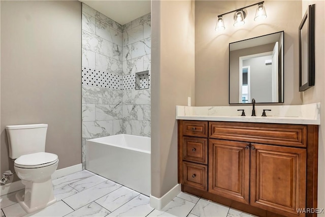 bathroom with bathtub / shower combination, toilet, vanity, baseboards, and marble finish floor