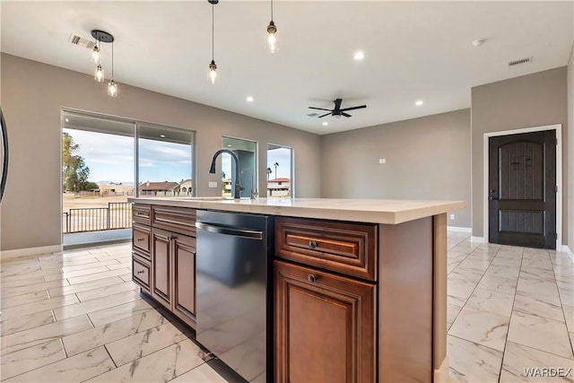 kitchen featuring dishwasher, an island with sink, decorative light fixtures, marble finish floor, and light countertops