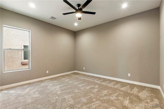 carpeted empty room featuring recessed lighting, visible vents, ceiling fan, and baseboards