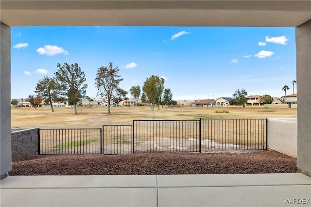 exterior space with a residential view and fence