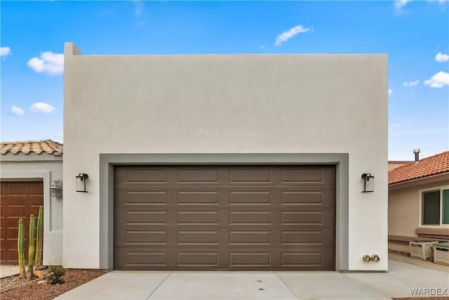 garage with concrete driveway