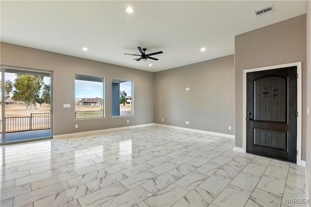 unfurnished room featuring ceiling fan, recessed lighting, visible vents, baseboards, and marble finish floor