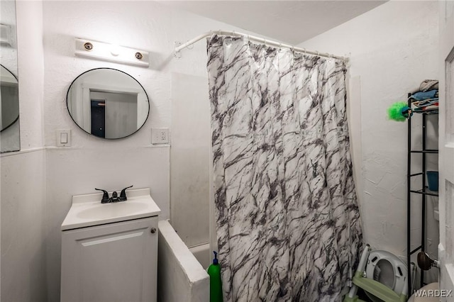 bathroom featuring vanity, toilet, and shower / bath combo with shower curtain