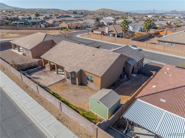 birds eye view of property with a residential view and a mountain view