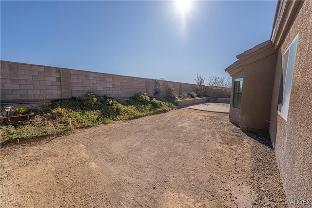 view of yard with a fenced backyard