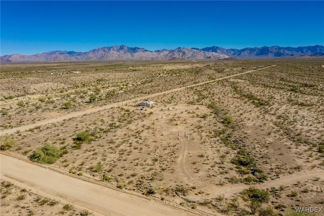 bird's eye view with a desert view and a mountain view