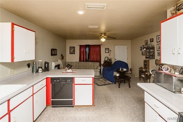 kitchen featuring a peninsula, white cabinets, open floor plan, light countertops, and dishwasher