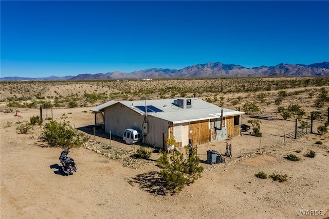 exterior space featuring a mountain view and view of desert