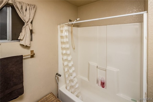 bathroom featuring shower / bath combination with curtain