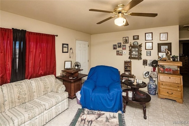 living area featuring a ceiling fan