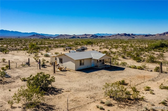 aerial view featuring a mountain view and view of desert