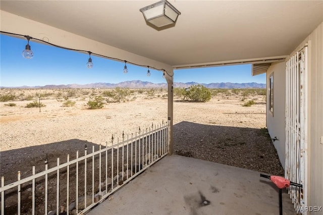 view of patio / terrace with a mountain view