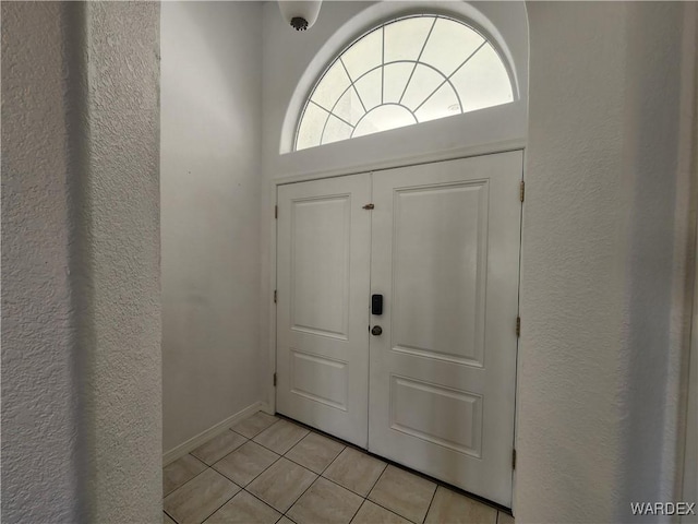 entrance foyer with light tile patterned flooring