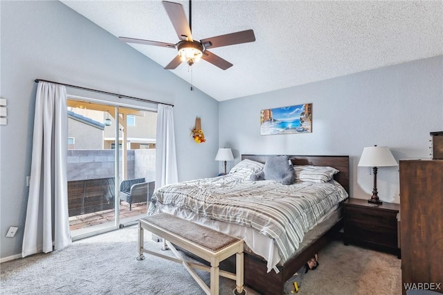 bedroom featuring access to exterior, carpet, vaulted ceiling, and a textured ceiling