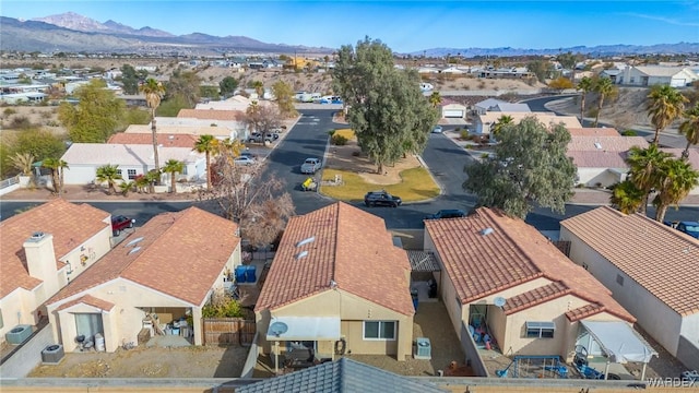 drone / aerial view featuring a residential view and a mountain view