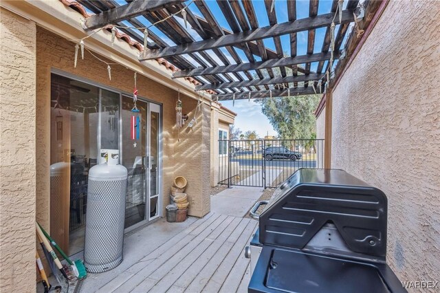 wooden terrace featuring a gate and a pergola