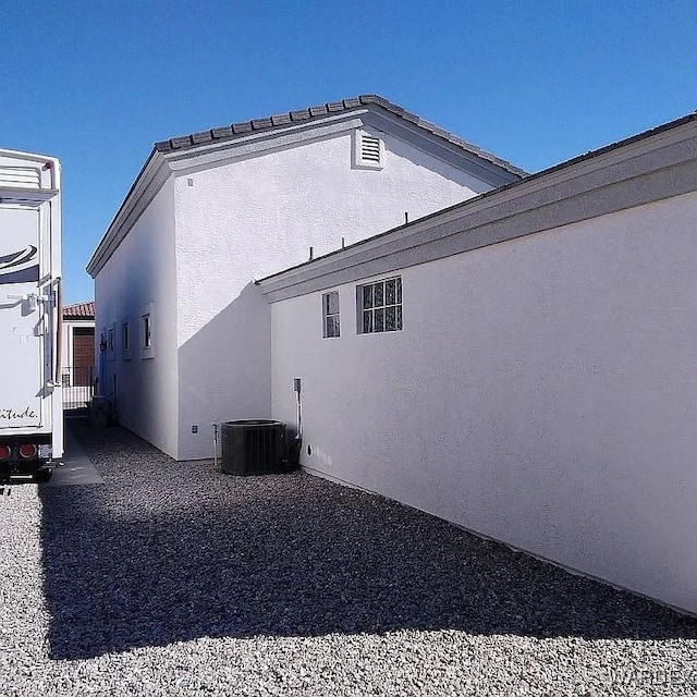 view of side of property with stucco siding