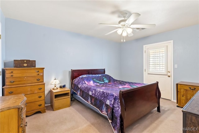 bedroom featuring light carpet and ceiling fan