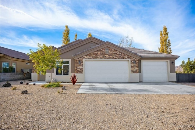 single story home featuring an attached garage, stone siding, concrete driveway, and stucco siding