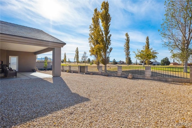 view of yard featuring a patio area and fence