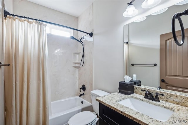 full bath featuring toilet, shower / bath combo with shower curtain, and vanity