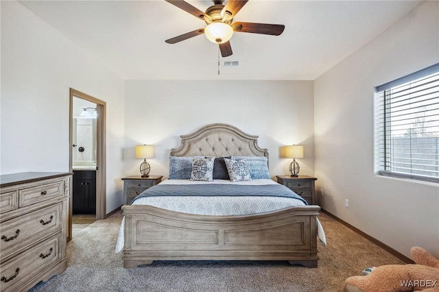 bedroom featuring connected bathroom, light carpet, a ceiling fan, visible vents, and baseboards