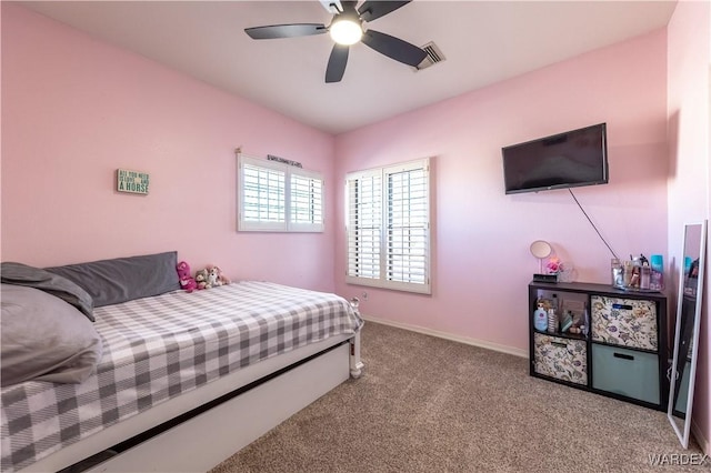 bedroom featuring carpet floors, visible vents, baseboards, and a ceiling fan