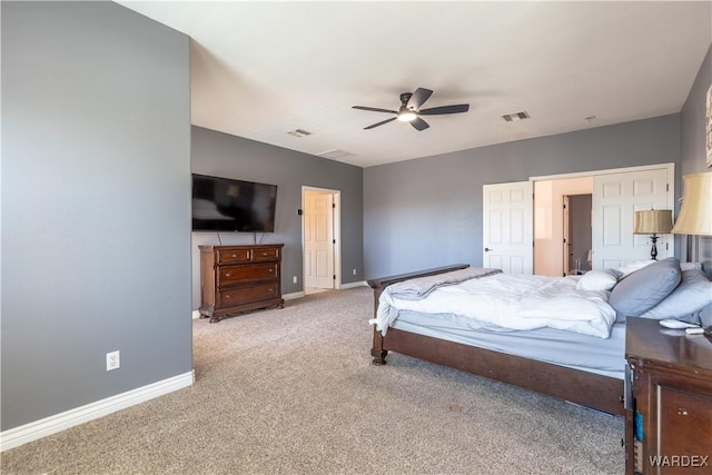 carpeted bedroom featuring baseboards, visible vents, and a ceiling fan