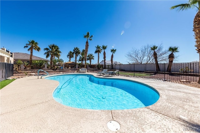 view of swimming pool with a patio, fence, and a fenced in pool