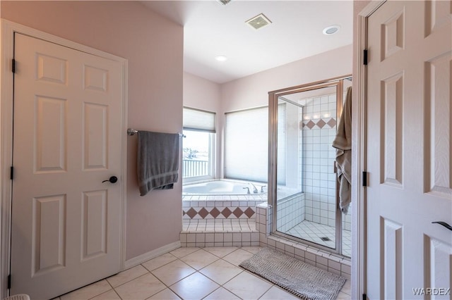 bathroom with a garden tub, a shower stall, visible vents, and tile patterned flooring