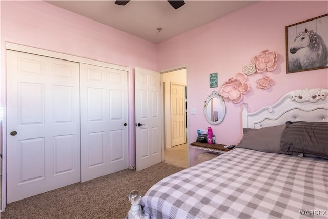 carpeted bedroom featuring ceiling fan and a closet