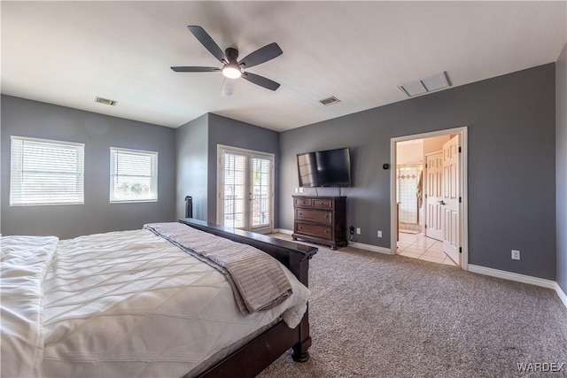 carpeted bedroom with ceiling fan, visible vents, and baseboards