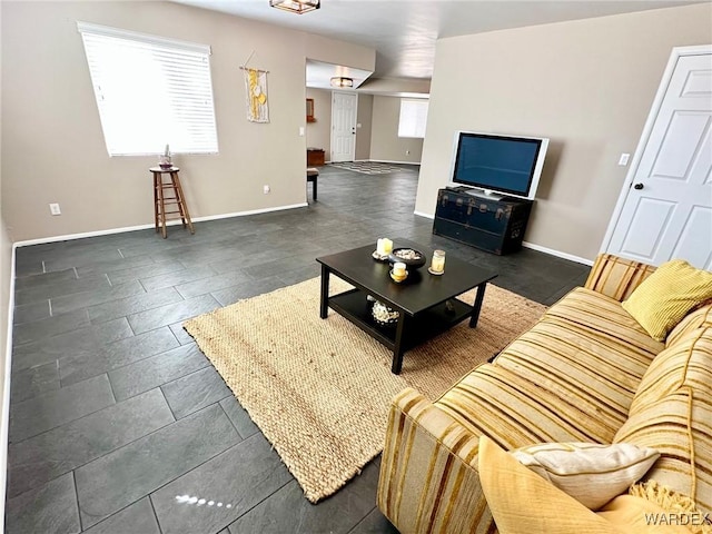 living room featuring baseboards