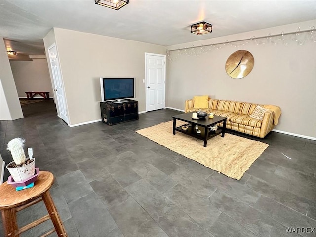 living room featuring baseboards