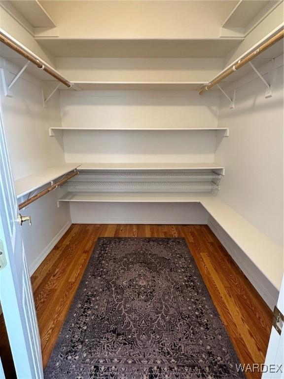 spacious closet featuring wood finished floors